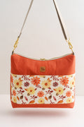 Schultertasche mit Blumenmuster in Terrakotta und Creme