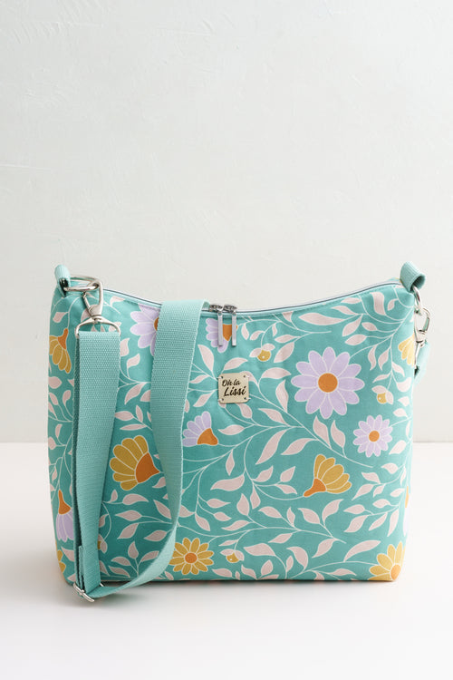 Crossbody Bag türkis mit floralem Grafikmuster