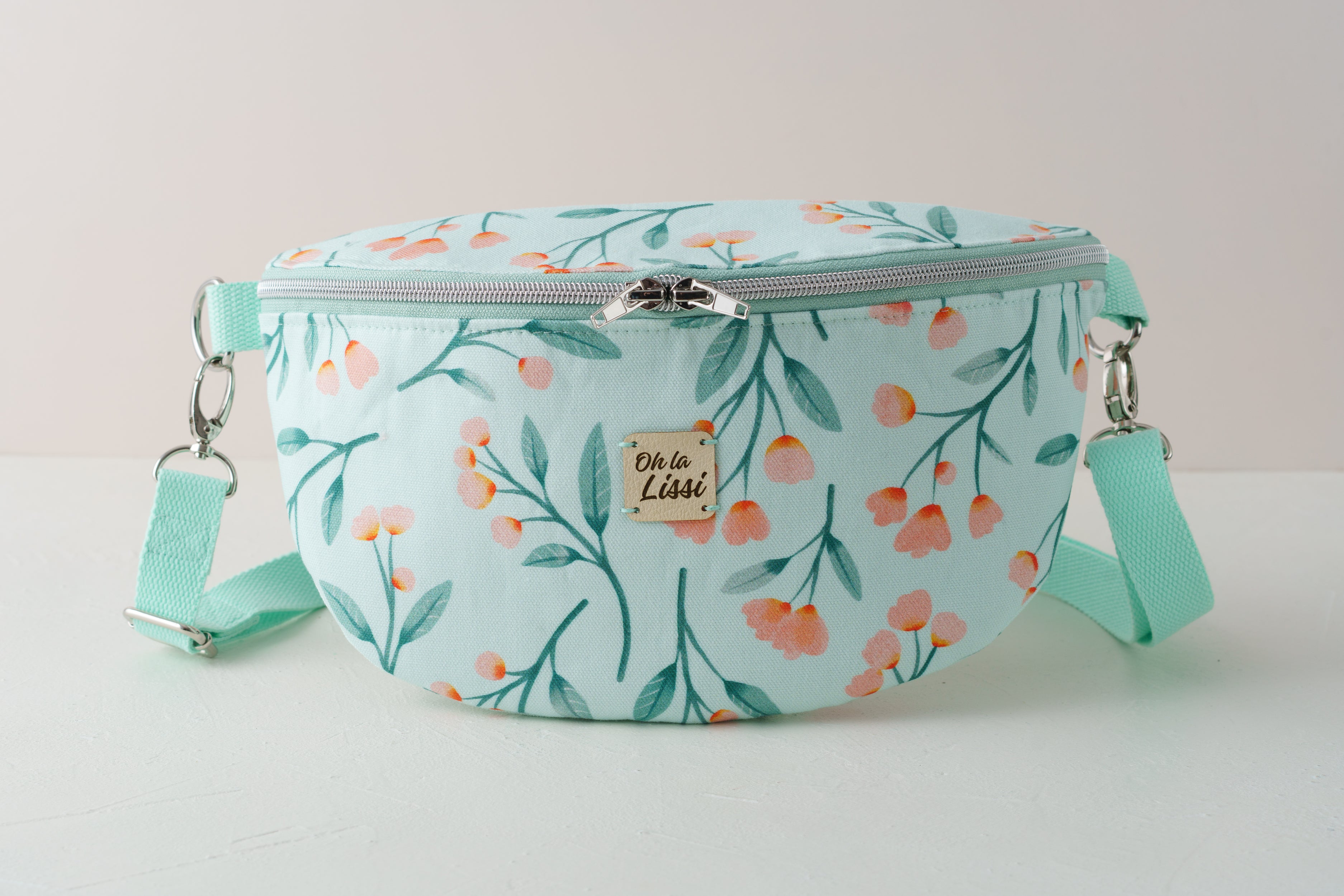 Bauchtasche mit Blütenmuster in Türkis und Rosa