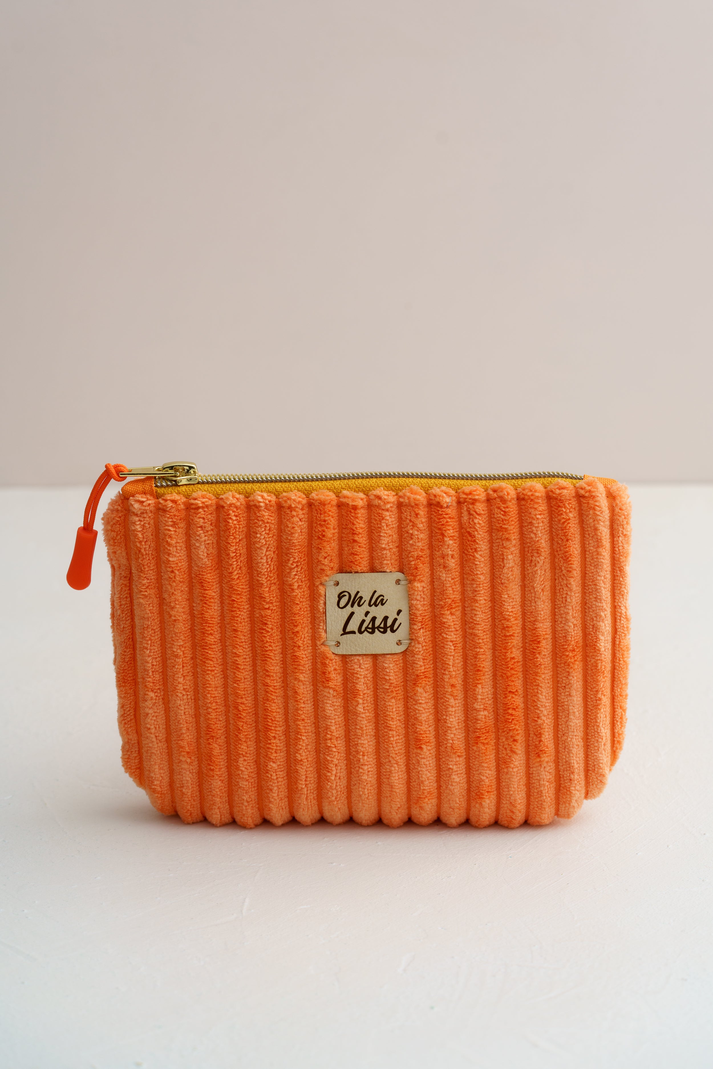 Handgemachte Kosmetiktasche aus orangefarbenem Cord